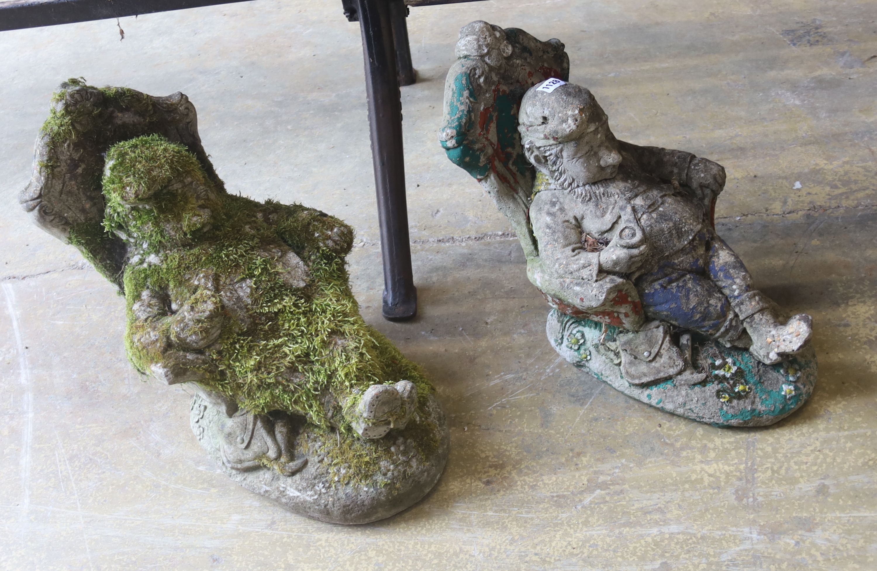 A pair of reconstituted garden ornaments modelled as seated gnomes, height 40cm